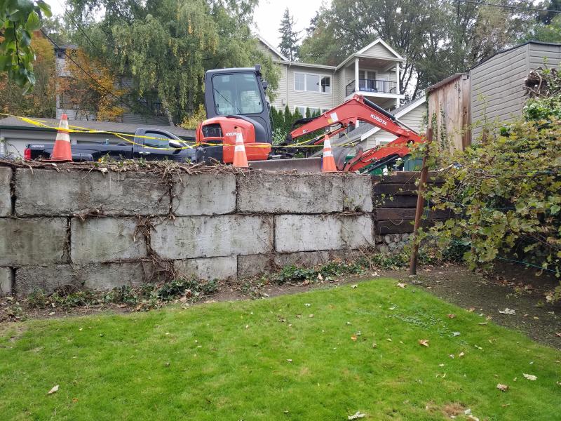 Retaining Walls, Parking Pad, Drain System.