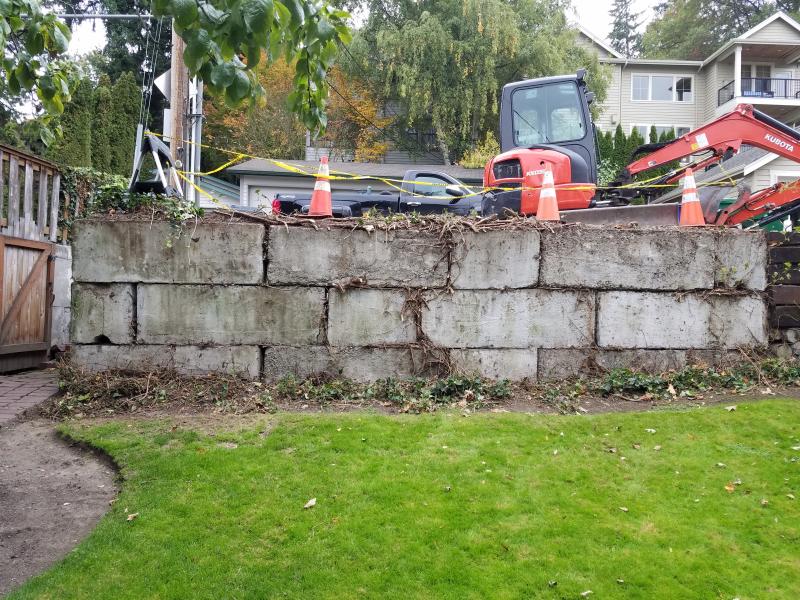 Retaining Walls, Parking Pad, Drain System.