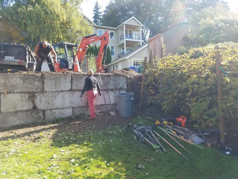 Retaining Walls, Parking Pad, Drain System.