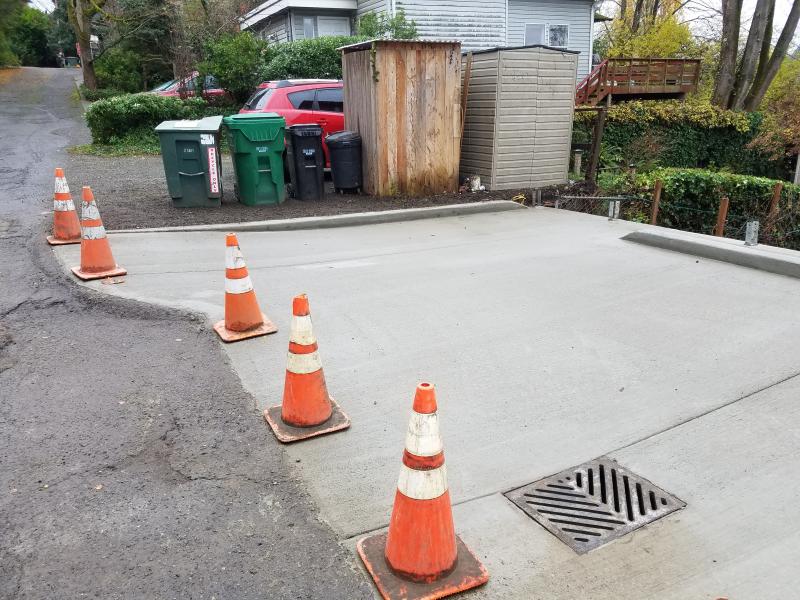 Retaining Walls, Parking Pad, Drain System.