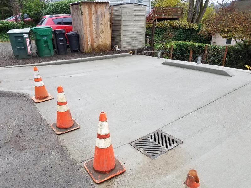 Retaining Walls, Parking Pad, Drain System.