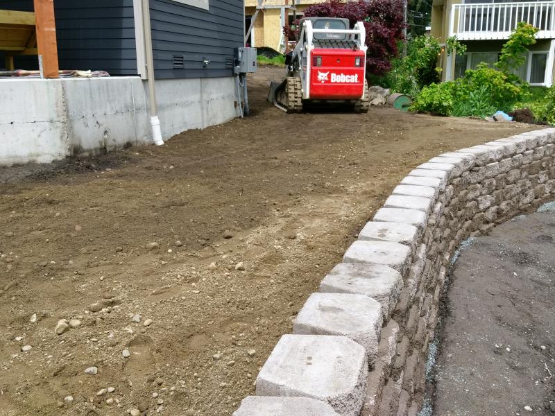  Retaining Walls, Regrading, Sod & Fence Installation.