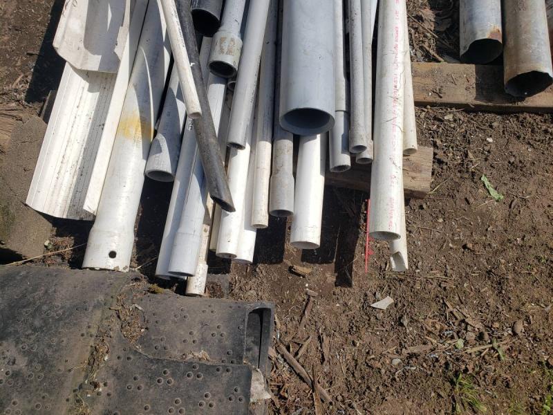 Lots of different kinds of pipe, conduit, downspout pipe. 