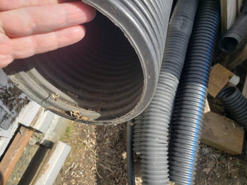 Lots of different kinds of pipe, conduit, downspout pipe. 